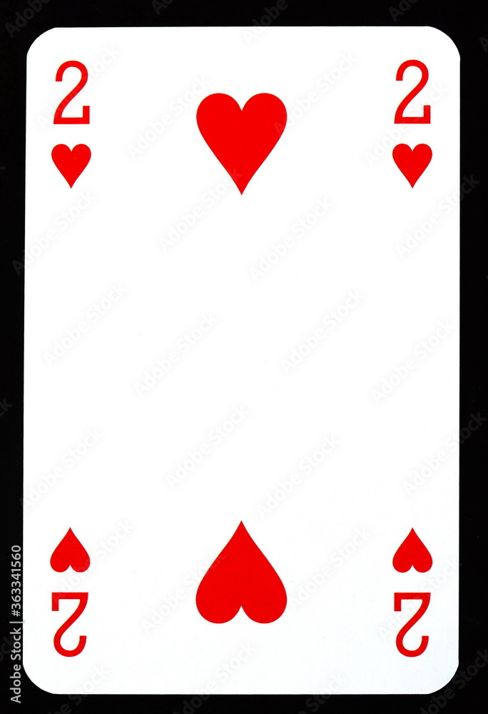Obraz premium Two of hearts playing card isolated on black.