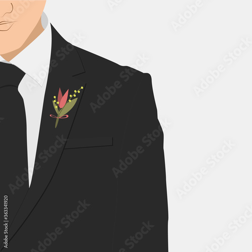 Boutonniere on a groom's jacket. Man in a black suit.
