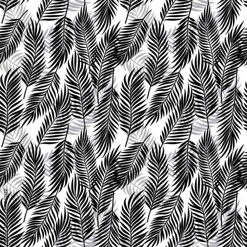 Seamless floral pattern. Tropical nature inspired. Palm branches in black and white.
