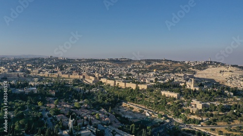 The old city of Jerusalem walls at sunset, aerial view old city, Jerusalem, Montefiore Windmill,golden dome of the rock, drone 