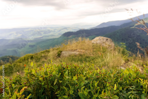 Green mountains against a frown sky