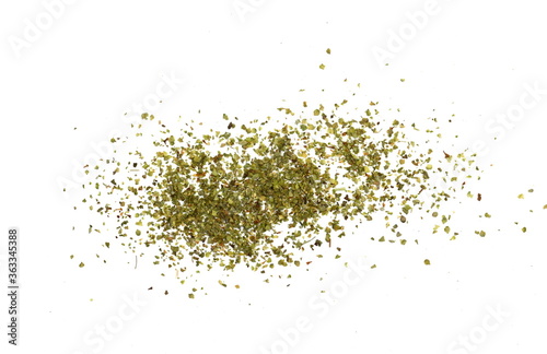 Pile of dried oregano isolated on white. Pile of dried oregano leaves on a white background. Spice for pizza. Pizza ingredient.