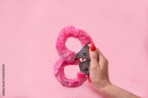 on a pink background sex product, toy for adults photo