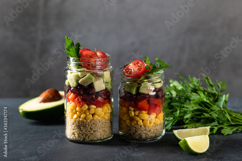 quinoa salad in a jar on a dark background