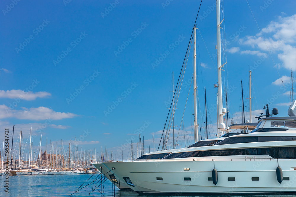 small modern sailing boats in the seaport of the spanish city of Palma de Mallorca small modern sailing boats in the seaport of the spanish city of Palma de Mallorca