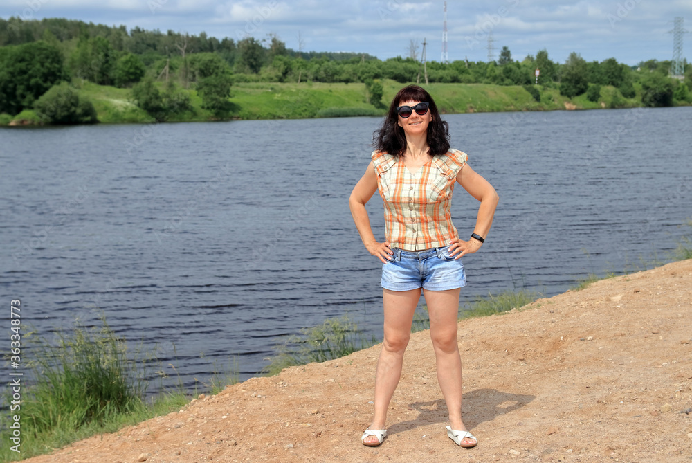 athletic woman by the lake