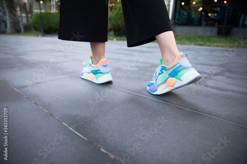 woman feet sport shoes walking