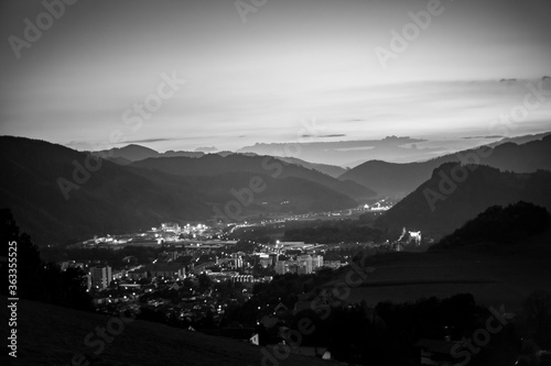 momochrome view of Leoben at dusk down from a small mountain photo