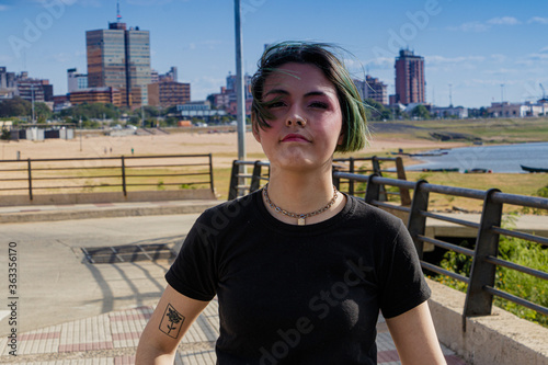 teenager with alternative look strolling on the street