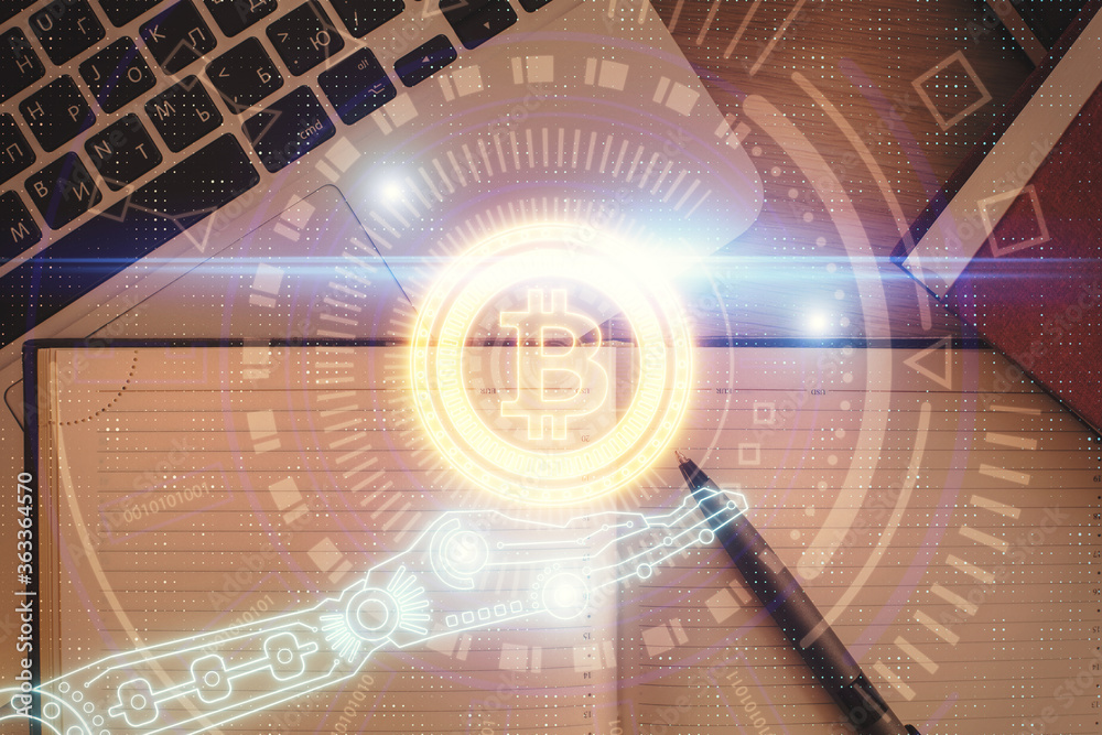 Blockchain theme hologram drawings over computer on the desktop background. Top view. Double exposure. Blockchain theme hologram drawings over computer on the desktop background. Top view. Double exposure.