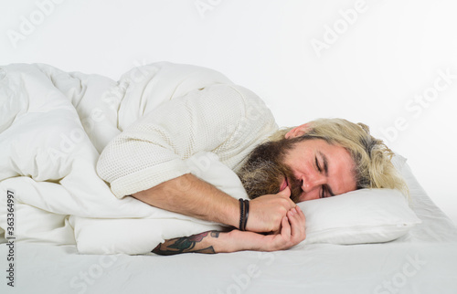 Happy to Sleep. Bearded man sleep in bed. Bearded man in bed. Morning and wake up. Man sleeping in comfortable bed at home. Man sleeping on white bed.