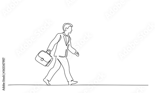 Man walking on street with briefcase. one line drawing