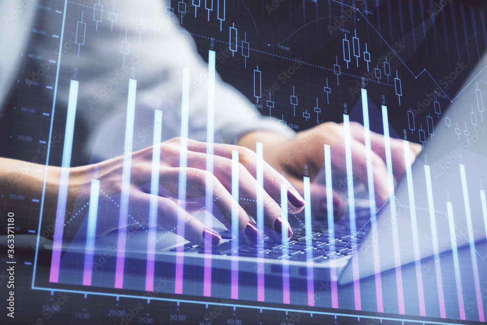 Double exposure of businesswoman hands typing on computer and forex chart hologram drawing. Financial analysis concept. Double exposure of businesswoman hands typing on computer and forex chart hologram drawing. Financial analysis concept.
