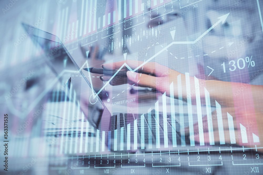 Multi exposure of woman hands typing on computer and financial graph hologram drawing. Stock market analysis concept. Multi exposure of woman hands typing on computer and financial graph hologram drawing. Stock market analysis concept.