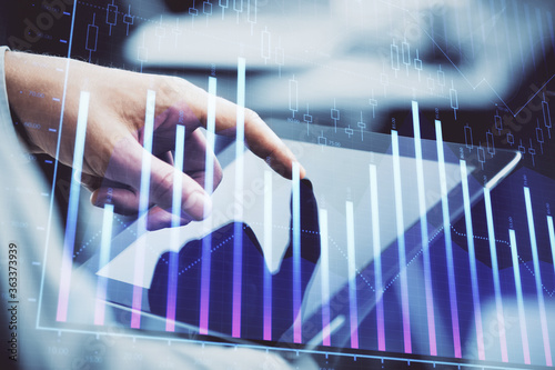 Wallpaper Mural Multi exposure of man's hands holding and using a phone and financial chart drawing. Market analysis concept. Torontodigital.ca