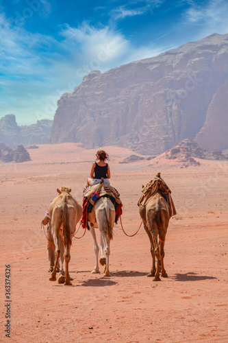 Female tourist riding a camel in the Wadi Rum desert  © Pierre vincent