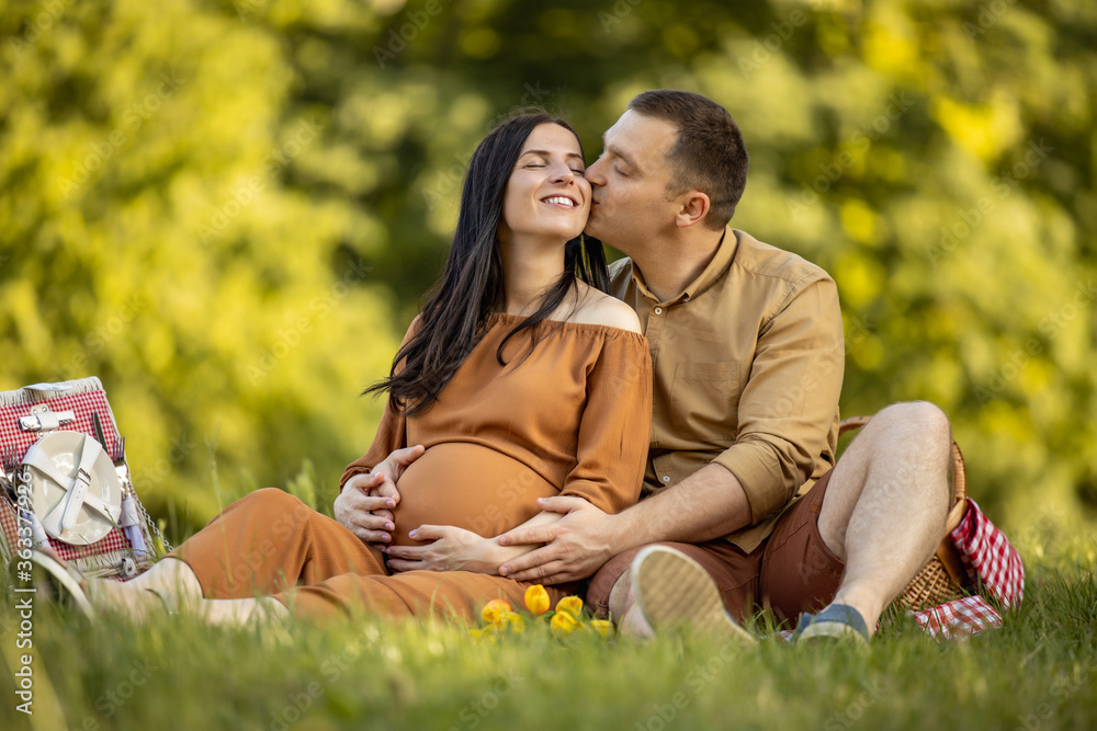 Happy couple enjoying in park in summer. Happy couple enjoying in park in summer.