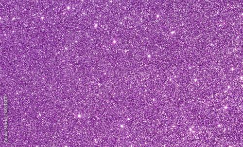 Abstract pink or purple shiny glitter background with shimmering light effects. Image is blank with copy space for text. Great for backdrop, textile, poster, textures, banners and surfaces.
