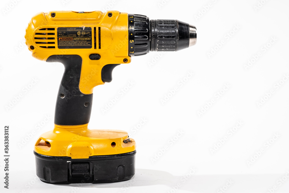 Cordless drill isolared on a white background with room for copy on the right