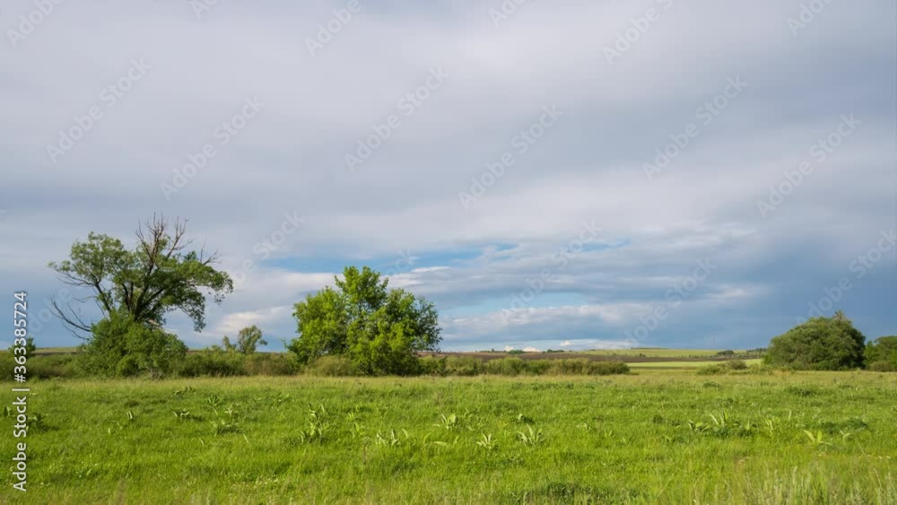 Timelapse. Clouds float high in the blue sky. The sunshine on a beautiful field Timelapse. Clouds float high in the blue sky. The sunshine on a beautiful field