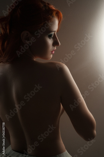 silhouette of woman posing with hard shadows in studio  sexy