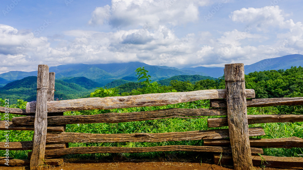 old wooden fence with mountains beyond old wooden fence with mountains beyond