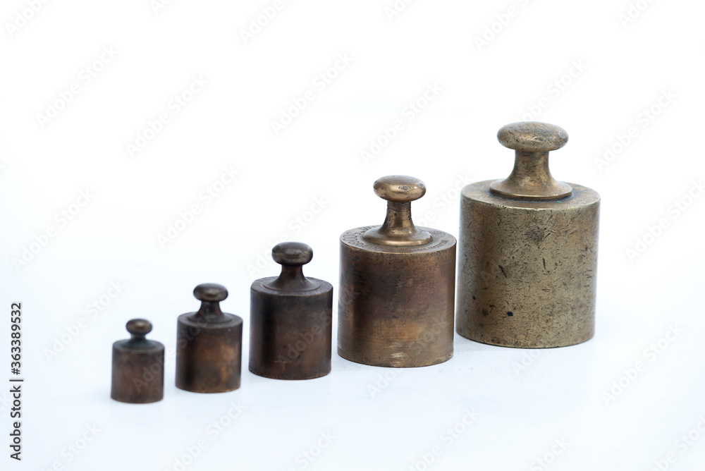 set of old bronze balance weights with white background
set of old bronze balance weights with white background