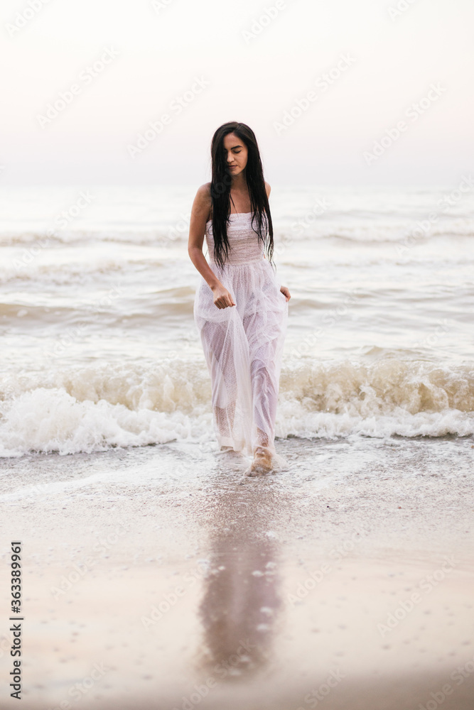 beautiful young woman enjoying a day at the beach beautiful young woman enjoying a day at the beach