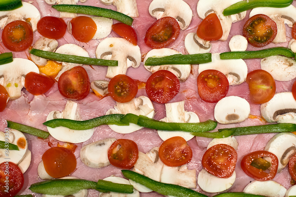 Home made pizza with ham, tomato, pepper and mushroom Home made pizza with ham, tomato, pepper and mushroom