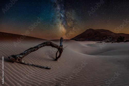 dreamy landscape with milky way and stars over Corralejo sand dunes, Fuerteventura, Spain.