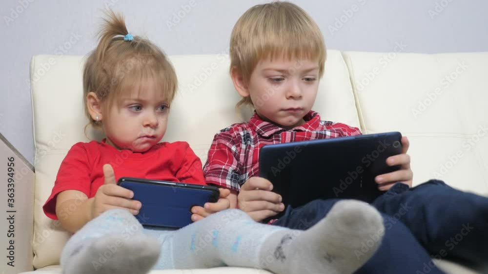 happy family teamwork kids watch online streaming video on a smartphone. children little boy lifestyle and girl brother sister watch online streaming broadcasting cartoons on the phone happy family teamwork kids watch online streaming video on a smartphone. children little boy lifestyle and girl brother sister watch online streaming broadcasting cartoons on the phone
