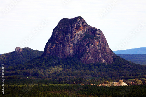 Glass House Mountains, Sunshine Coast, Queensland, Australia showing blue sky, mountains, paddocks, farming land and forests photo