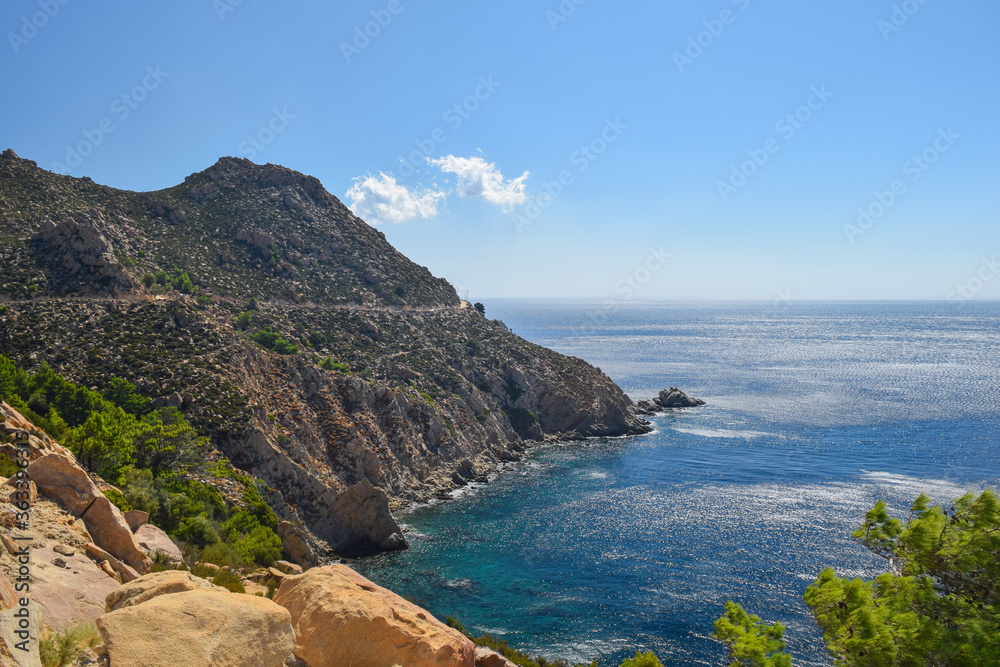 Ikaria coastline cliff landscape with aegean sea byside