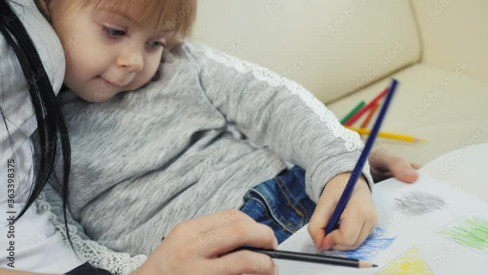 little girl and mom draw lifestyle teamwork happy family concept. child daughter with woman a are engaged in pencil drawing lesson with children development of creativity little girl and mom draw lifestyle teamwork happy family concept. child daughter with woman a are engaged in pencil drawing lesson with children development of creativity