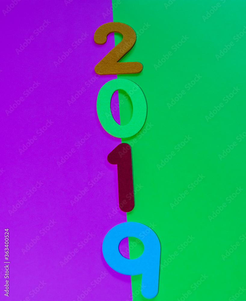 Fototapeta premium Numbers 2019 on green and maroon background.