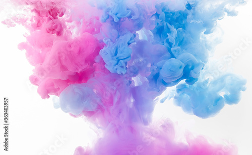 abstract colorful pink and blue dye in water on white background