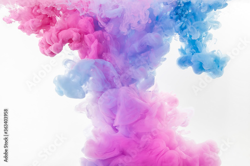 abstract colorful pink and blue dye in water on white background