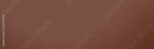 Smooth texture of milk chocolate.Chocolate photo background.