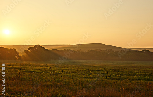 sunrise over the foggy flint hills of Kansas