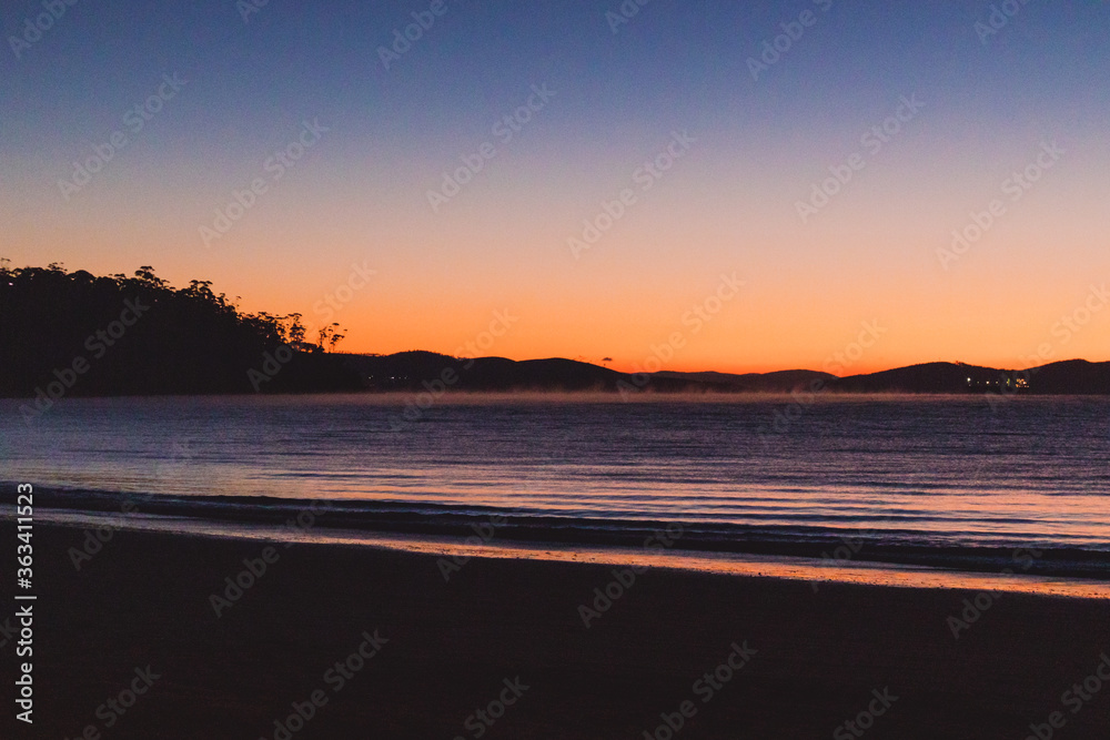 sunset sky with beautiful color gradient over Kingston Beach in Tasmania, Australia