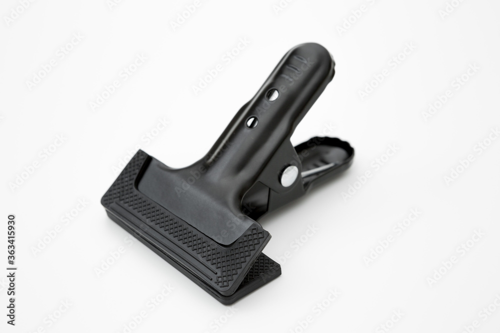 Black clamp used in industry on a white backgrou Black clamp used in industry on a white backgrou