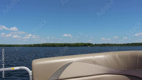 Boating On The Beautiful And Peaceful Kawartha Lakes In Ontario, Canada Under The Blue Sky. - wide rolling photo