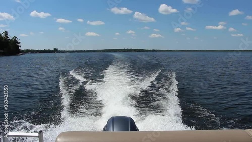 Stunning Beauty Of Nature From A Moving Speedboat Leaving A Wake On The Water In Kawartha Lakes, Ontario, Canada. photo