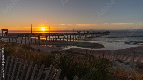 Timelapse Slider Shot of Bogue Inlet Fishing Pier at Sunrise - Emerald Isle, North Carolina  photo