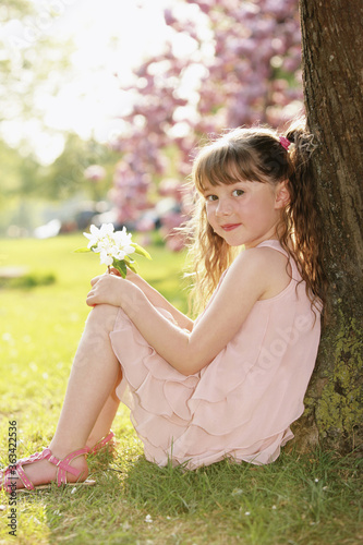 Girl holding a white flower