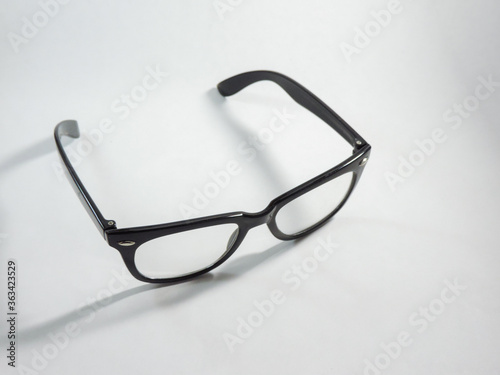 black framed glasses on white background