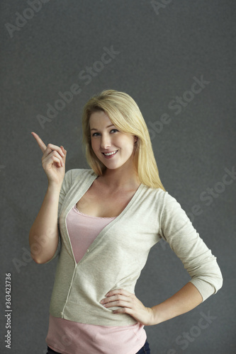 Woman pointing to the side