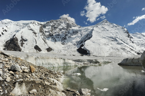Melting of snow layers and glaciers at the foot of the Khan Tengri mountain.