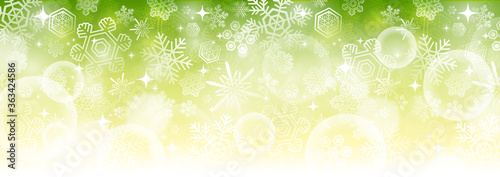 【冬・クリスマス素材】横長のキラキラした雪の結晶のベクター背景画像 緑色