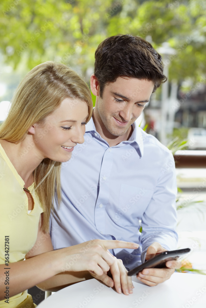 Man and woman reading text message Man and woman reading text message